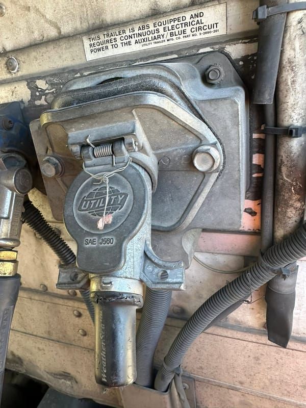 New 7-way electrical receptacle installed on the front of a semi trailer