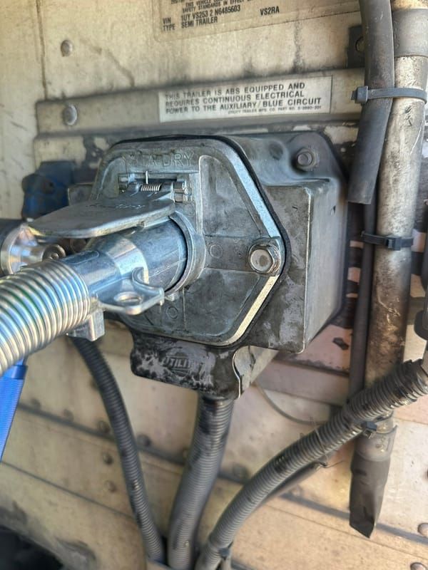Trailer 7-way receptacle with the plug connected after an electrical repair